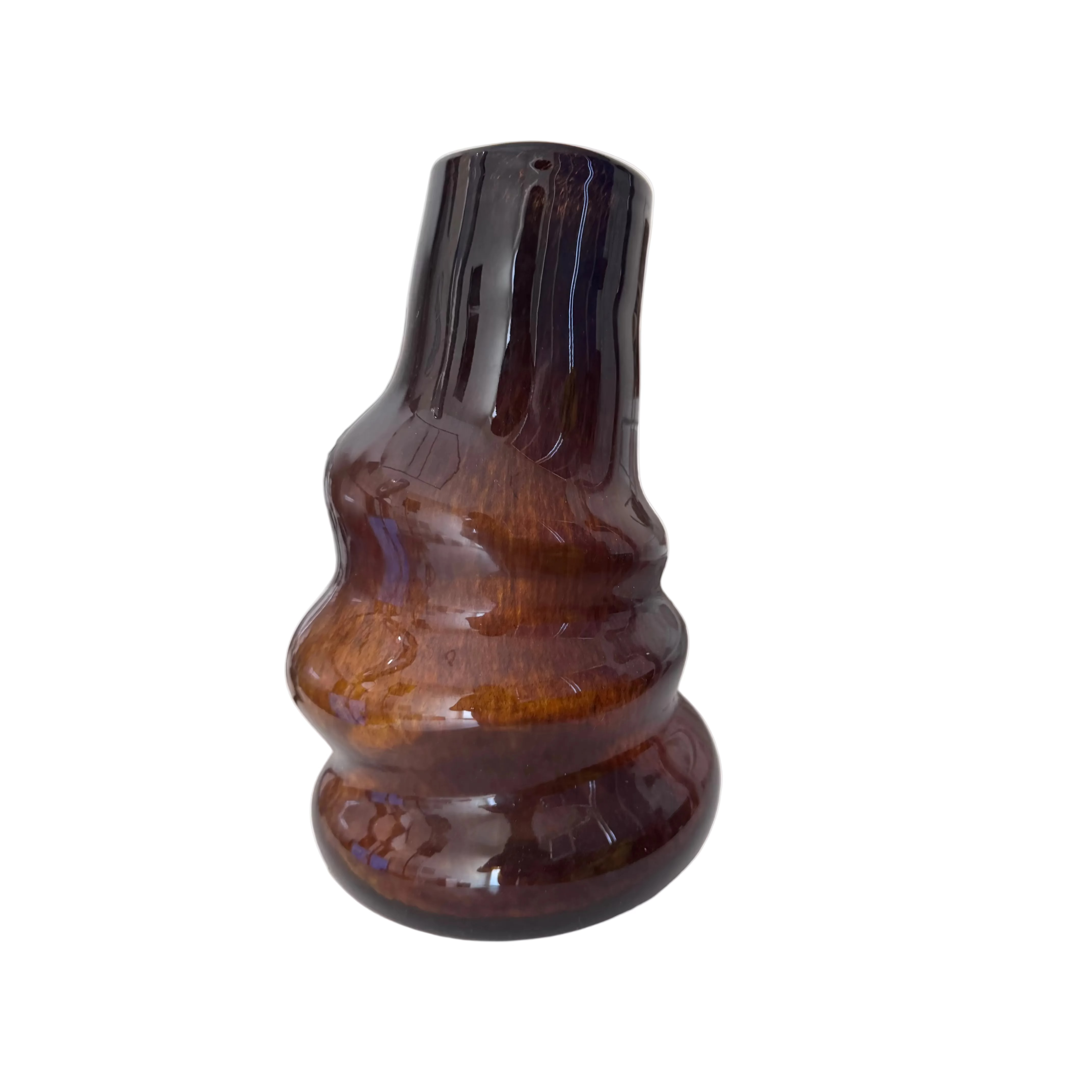 Brown glass bottle on a white surface with a blurred background