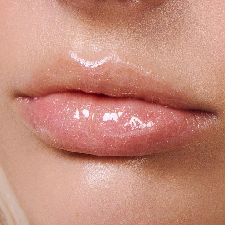 Close-up of glossy lips with a focus on texture and color.