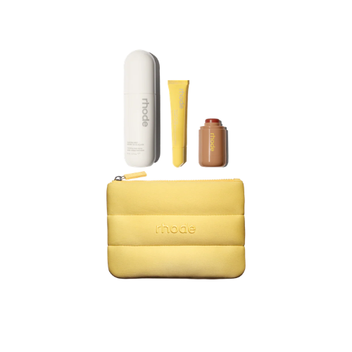 Yellow pouch with skincare products on a white background