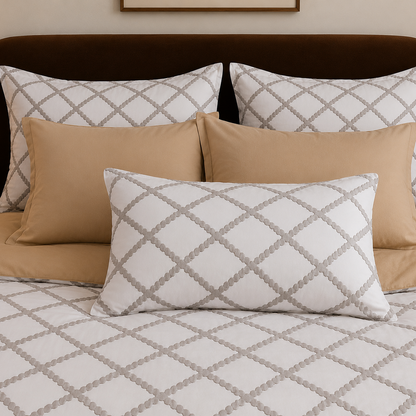 Bed with patterned pillows and bedding in a bedroom setting