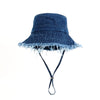Denim bucket hat with frayed edge on a white background