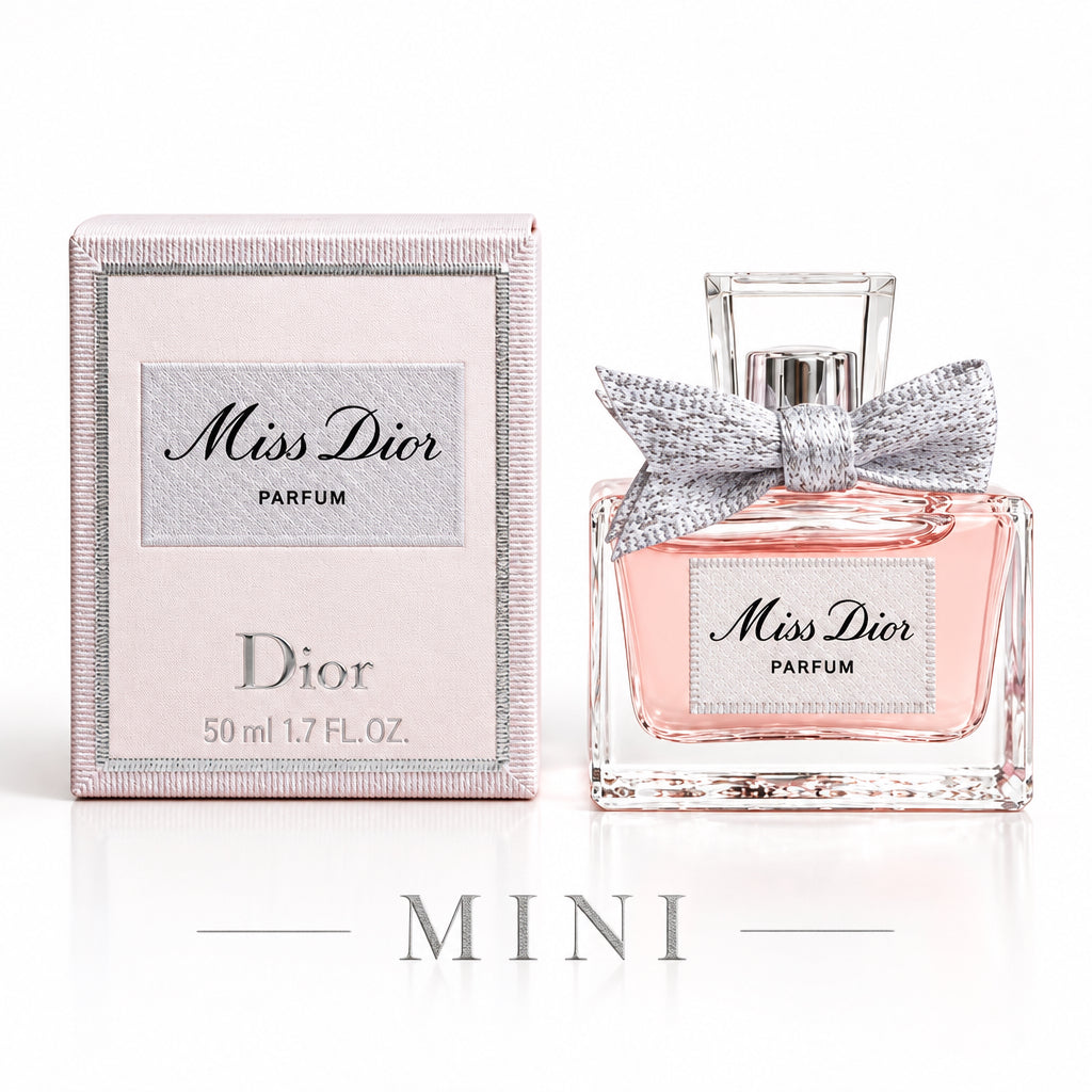 Dior Miss Dior Parfum bottle with a silver bow next to its light pink packaging box on a white background.