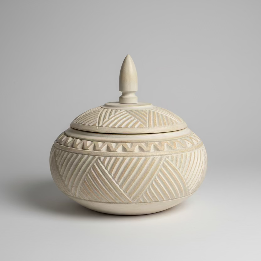 Ceramic container with geometric patterns on a gray background