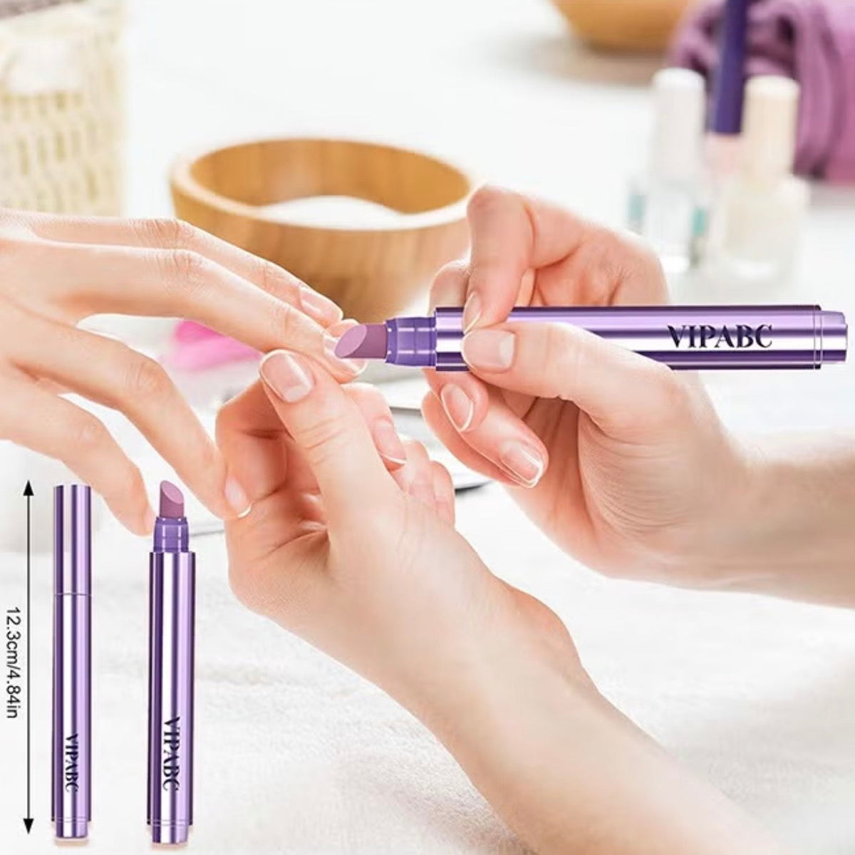 A close-up of a manicure application scene showing a hand holding a purple cylindrical nail product while another hand receives the tip. The product tube is labeled VIPADE.