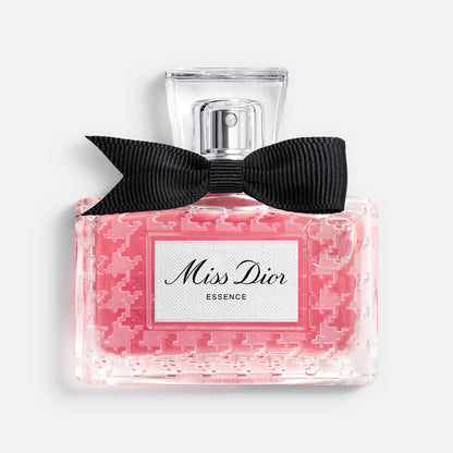 Miss Dior perfume bottle with pink packaging and black bow on a white background