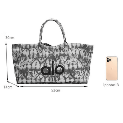 Alo Trendy Shopper Tote in a grey tie-dye pattern - BusDeals