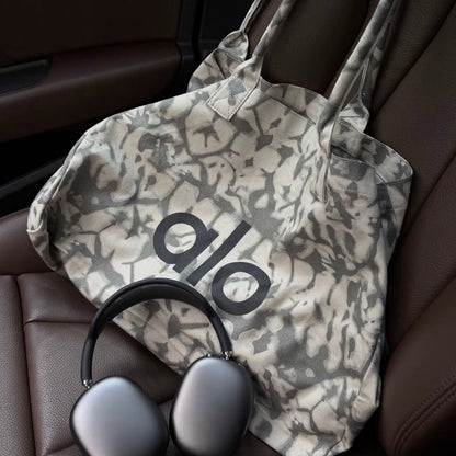 Alo Trendy Shopper Tote in a grey tie-dye pattern - BusDeals
