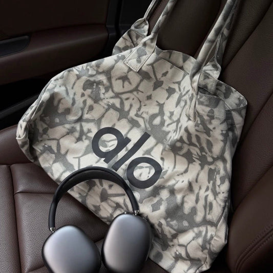 Alo Trendy Shopper Tote in a grey tie-dye pattern - BusDeals
