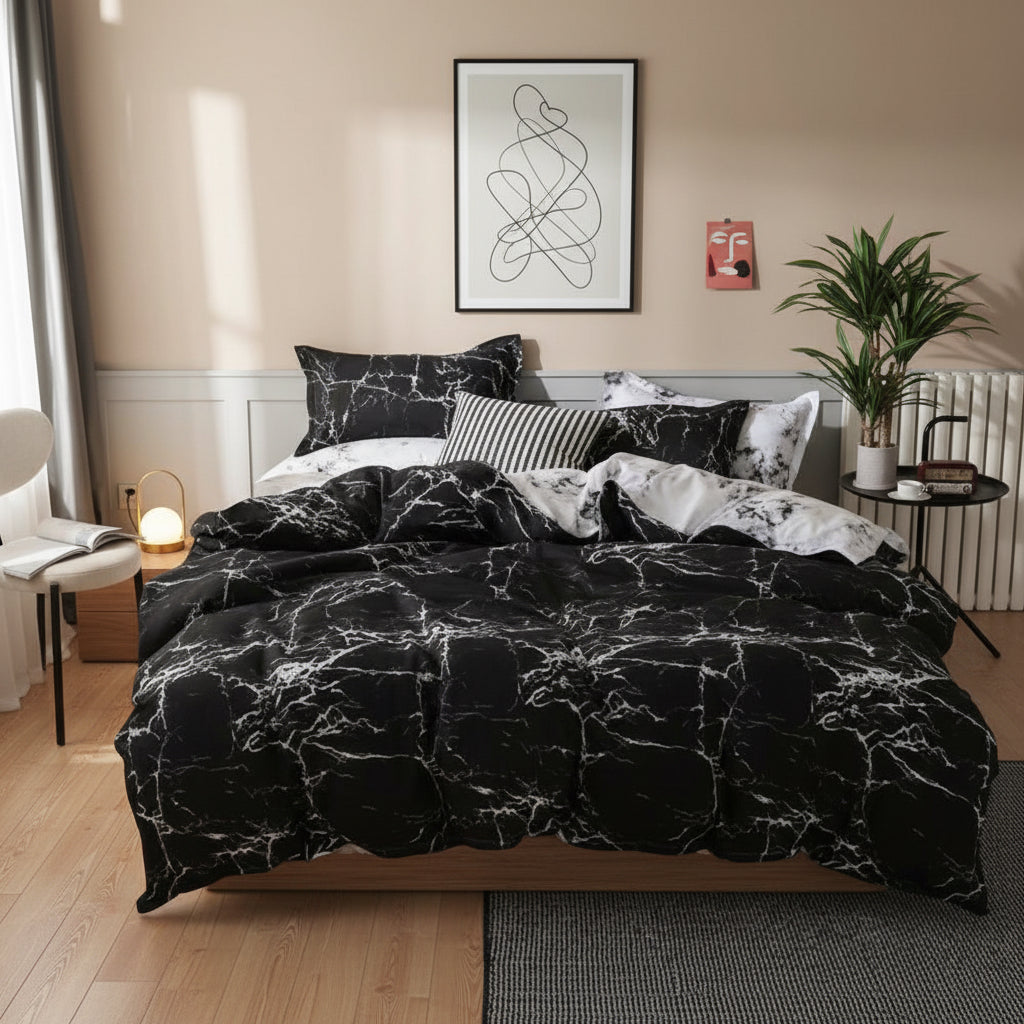 Bed with black marble patterned bedding in a bedroom setting.