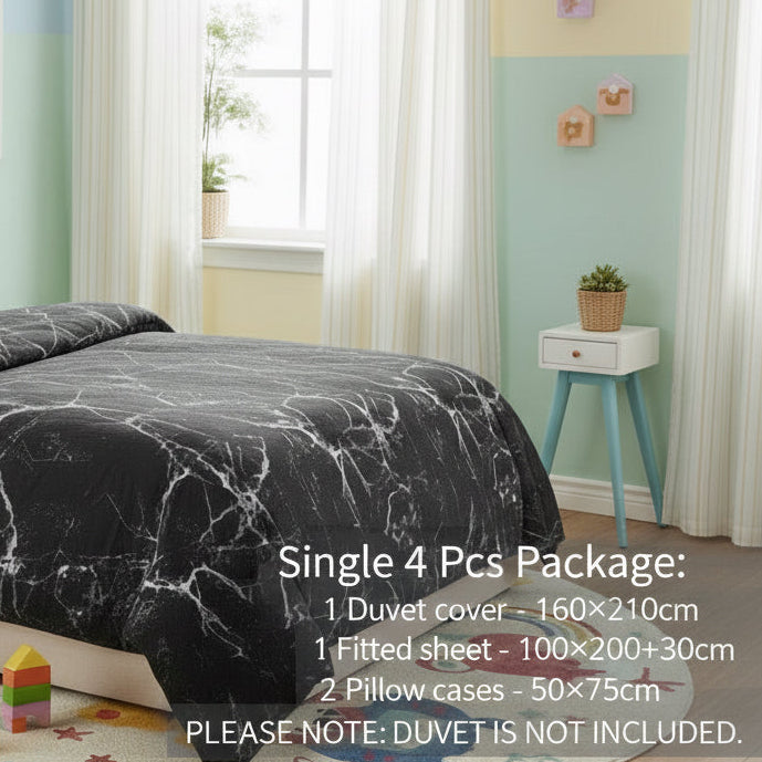 Children's bedroom with marble-patterned bedding and colorful toys on the floor.