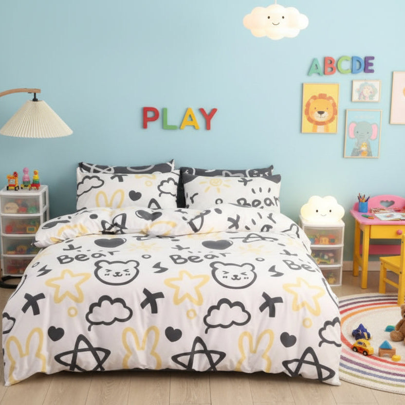 A single-sized bedding set with a bear and yellow stars design on a white background, including a duvet cover, fitted sheet, and two pillowcases, displayed in a bedroom setting.